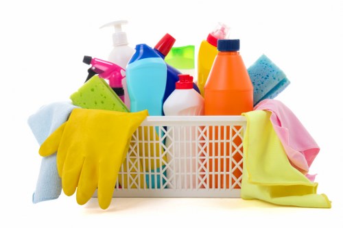 Professional office cleaners working in a SW13 workplace reception area