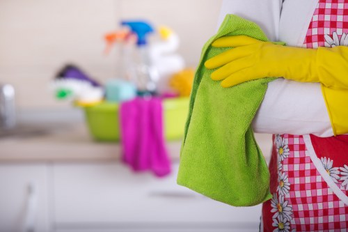 Kitchen domestic cleaning in SW13 with polished worktops and appliances