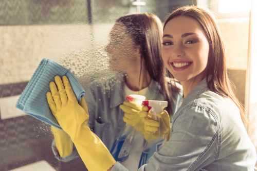 Professional post builders cleaning equipment in SW13 home