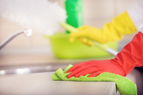 Cleaning technician using extraction equipment on a carpet